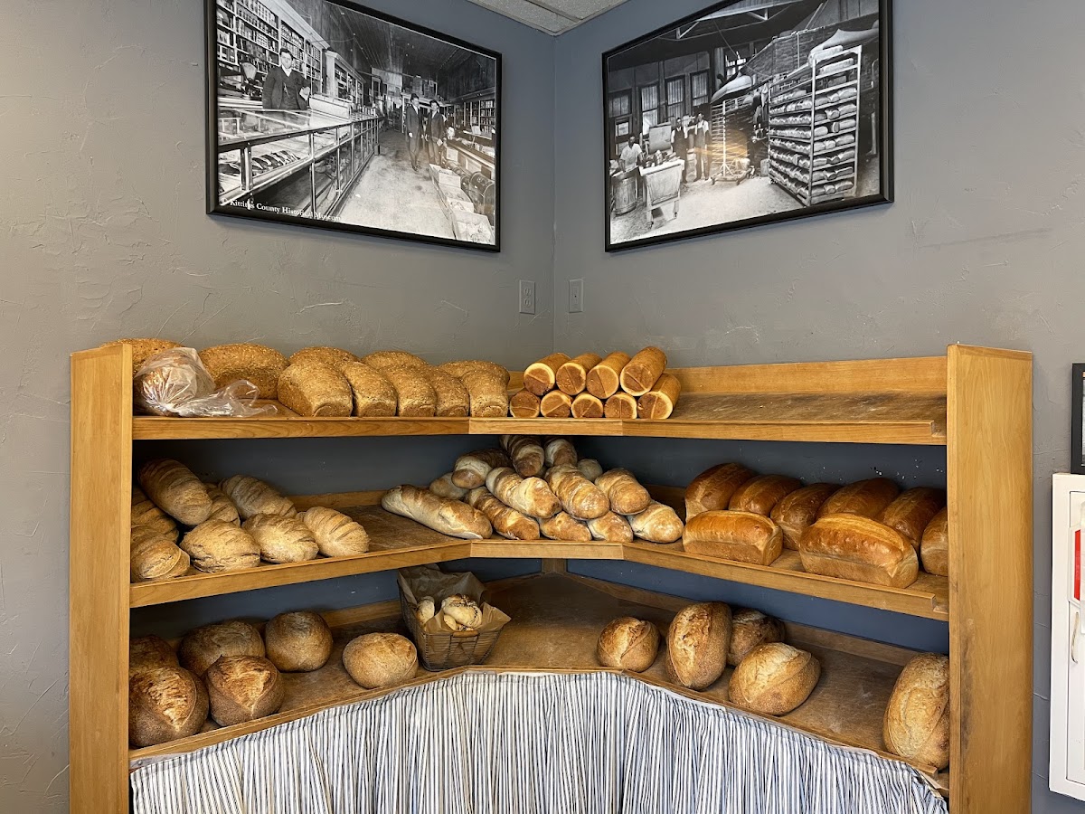 Shelves of fresh-baked artisan loaves and baguettes at Vinman's Bakery